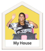 Woman in a wheelchair with the words My House at the bottom